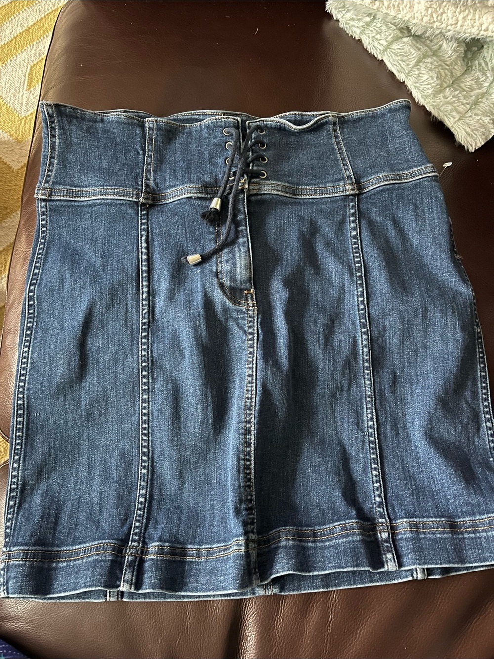 Free People blue denim mini skirt with lace up detail, size 12 cotton stretch